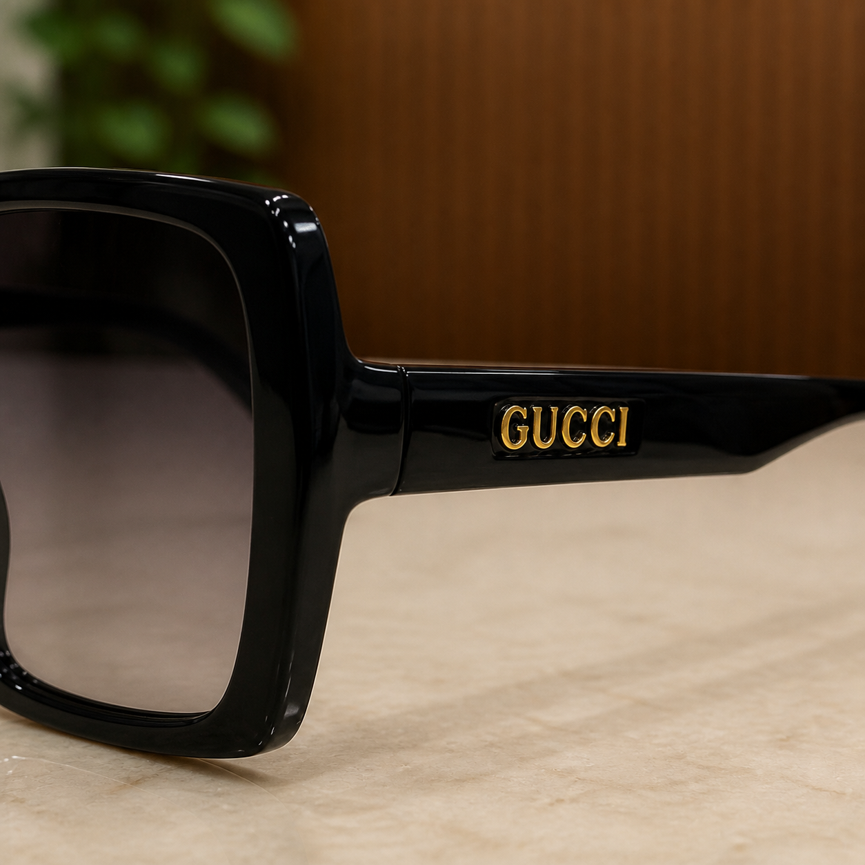 Gucci black sunglasses gold logo temple detail