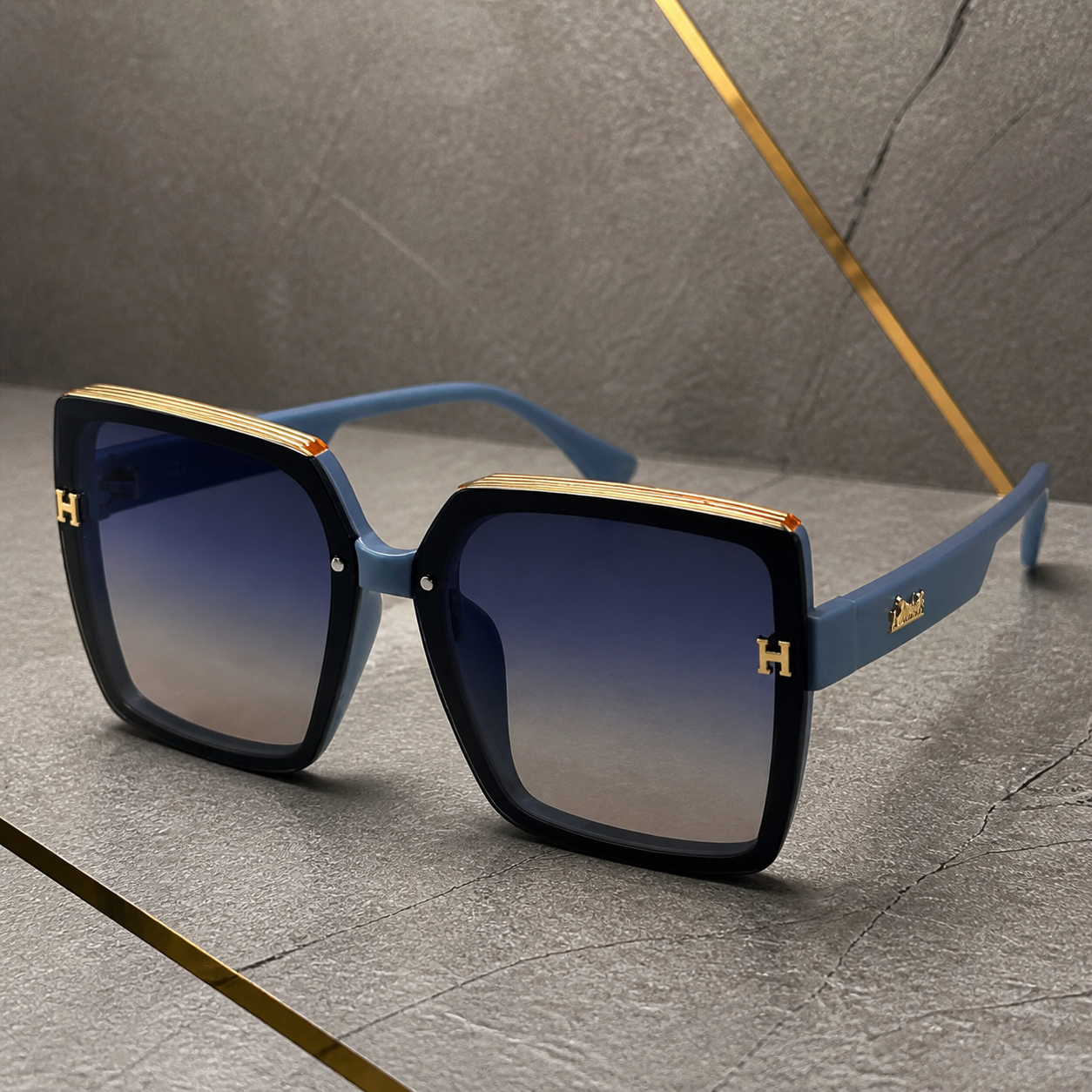 Hermes oversized square sunglasses in slate blue, gold trim and temple detail