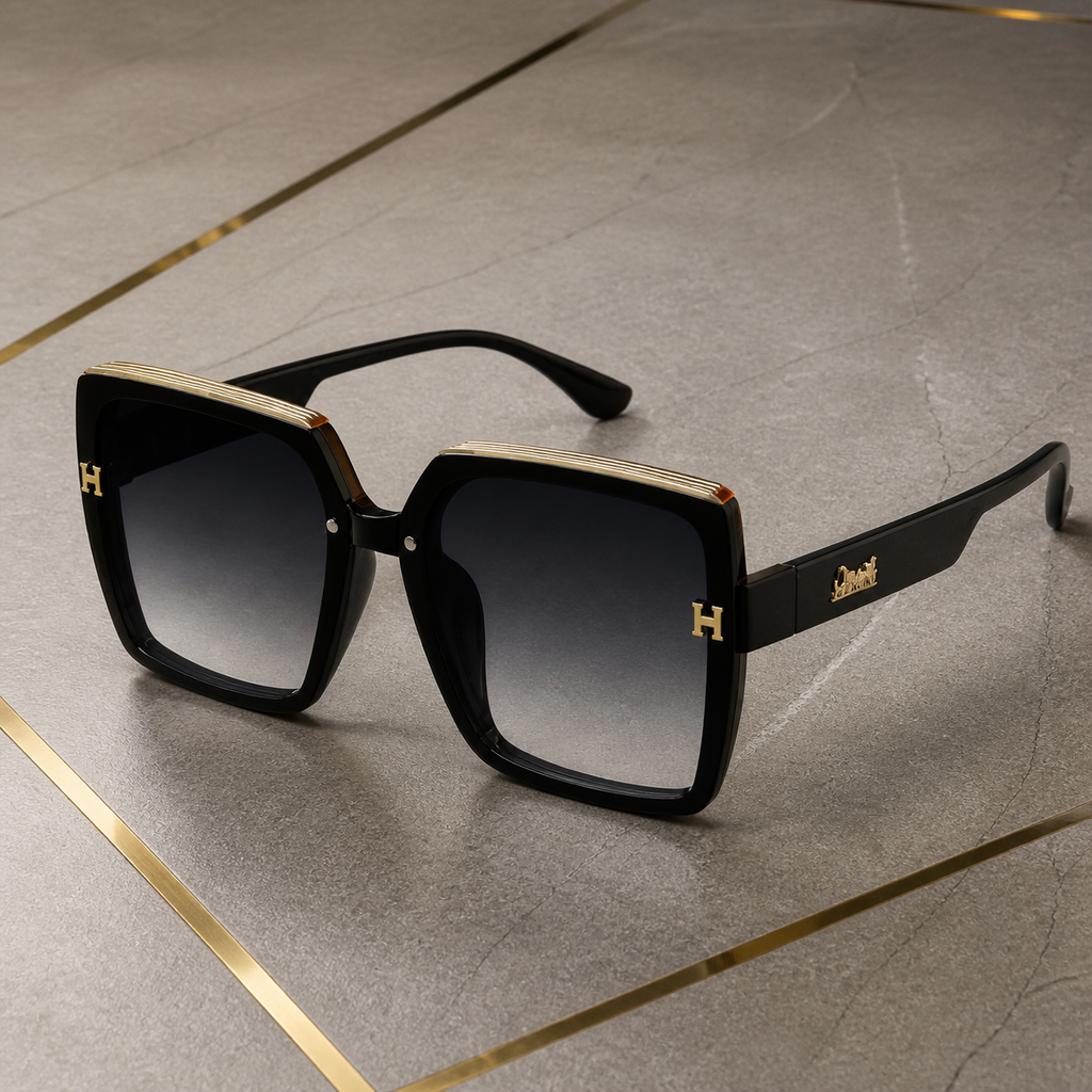 Hermes oversized square sunglasses in glossy black, gold trim and temple detail