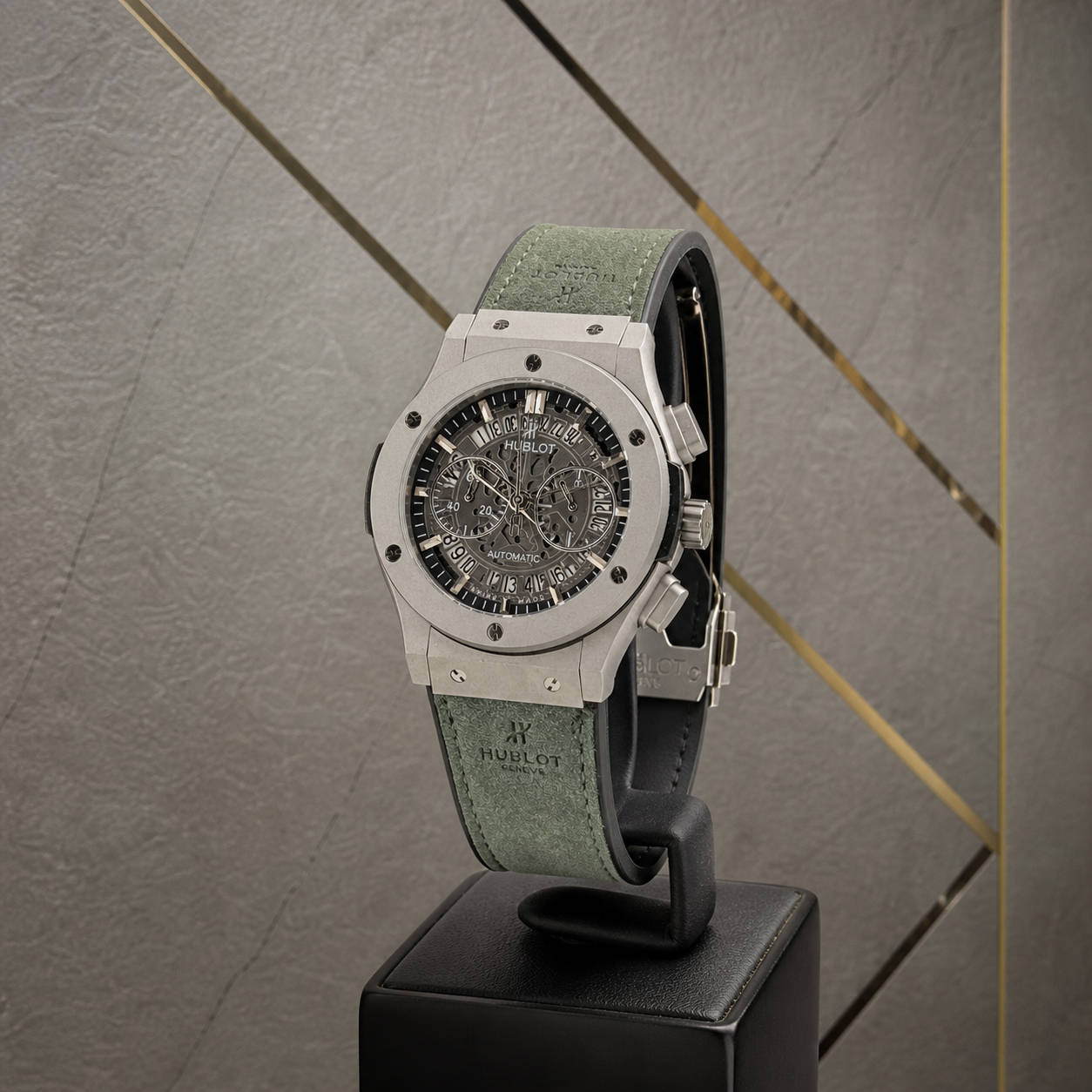 Hublot Big Bang silver-tone skeleton watch with green strap three-quarter view
