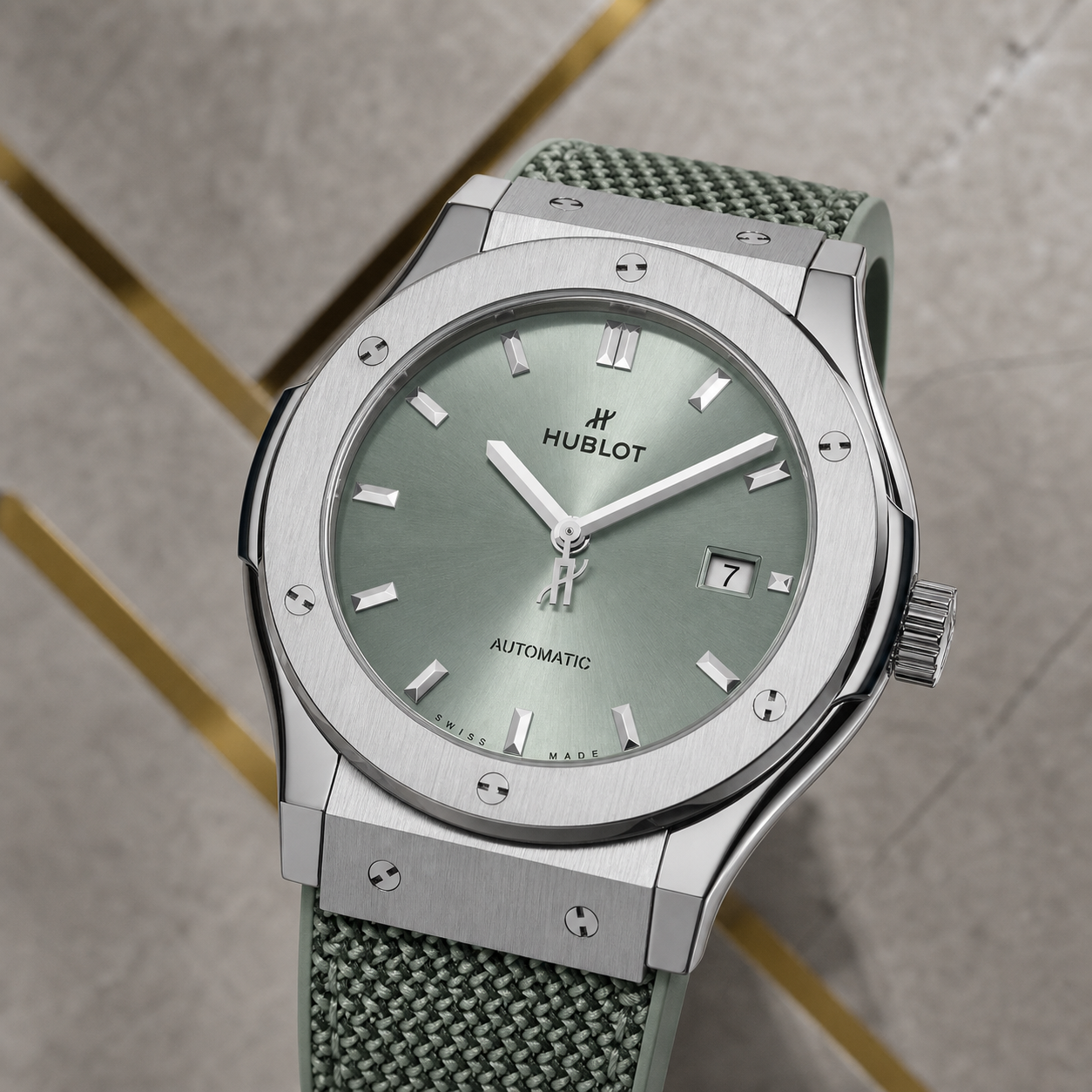 Hublot Classic Fusion sage green sunray dial and date display detail