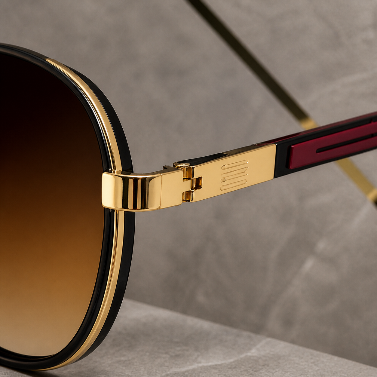 Hugo Boss sunglasses gold-tone hinge and burgundy temple detail