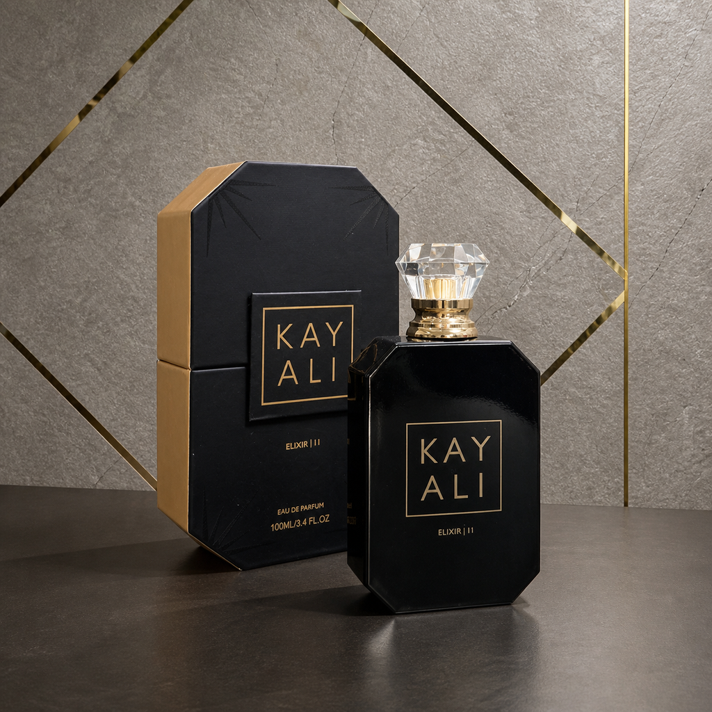 Kayali Elixir | 11 Eau de Parfum 100ml with box on stone and gold office wall