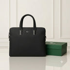 Black Lacoste laptop bag front view beside a Lacoste box