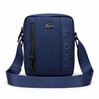 Lacoste On The Go small messenger bag in Navy on a white background