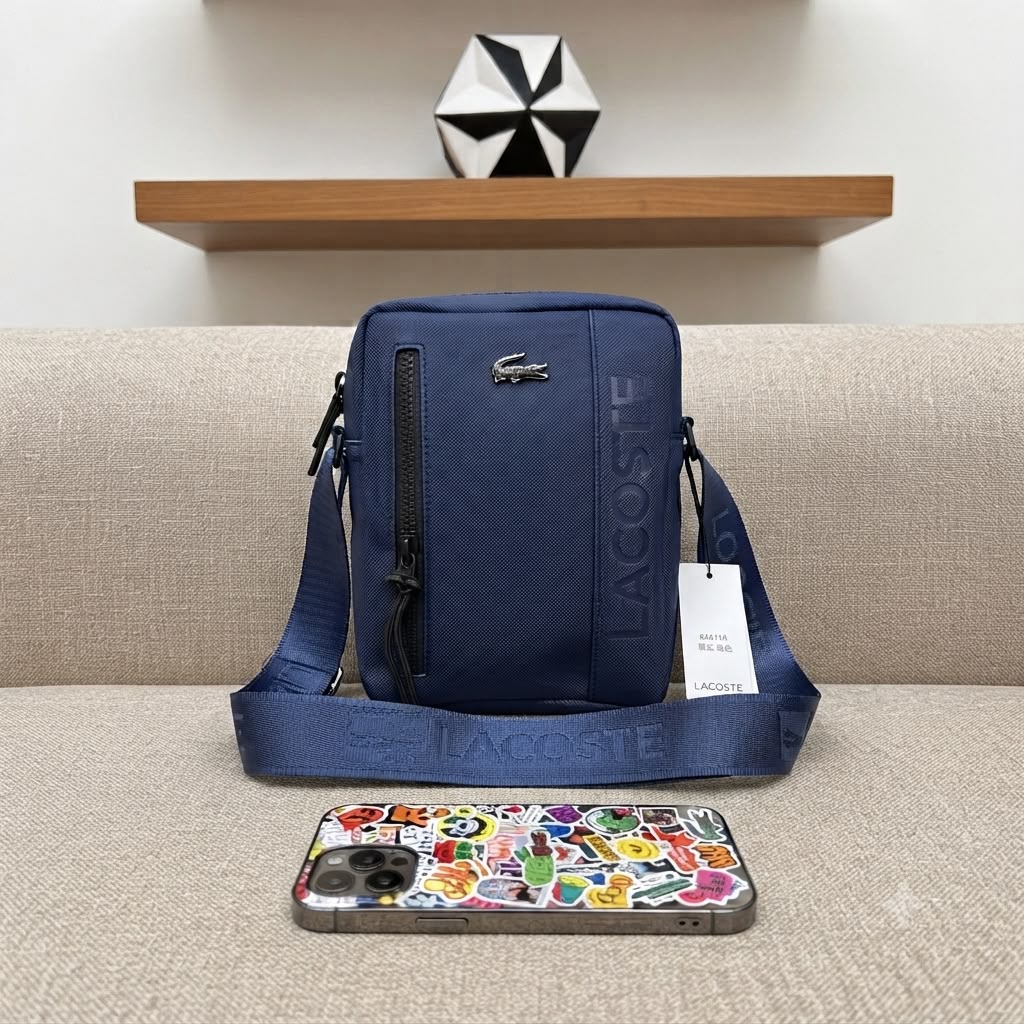 Lacoste On The Go small messenger bag in Navy with adjustable strap