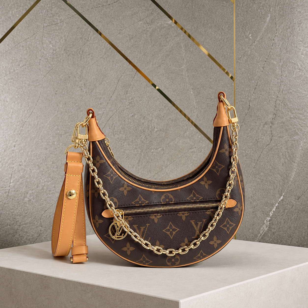 Louis Vuitton Loop brown monogram handbag on grey and gold office wall