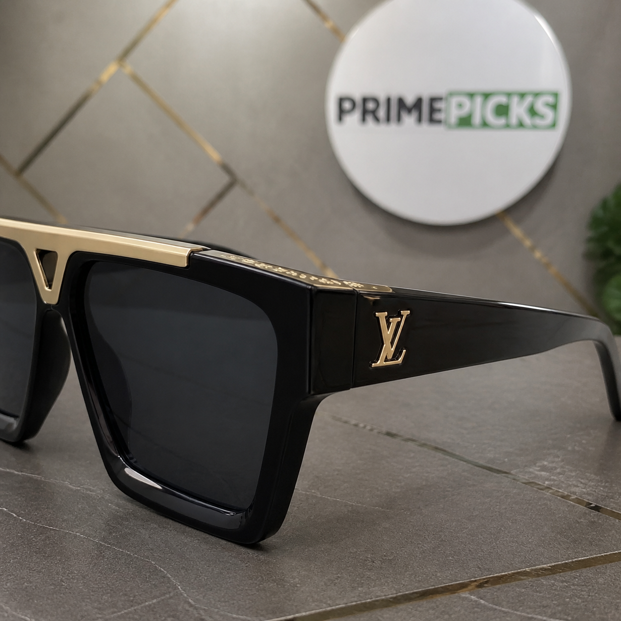 Louis Vuitton sunglasses gold-tone LV temple and upper inlay detail