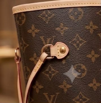 Louis Vuitton Neverfull-style tote side drawcord and hardware detail