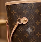 Louis Vuitton Neverfull-style tote side drawcord and hardware detail