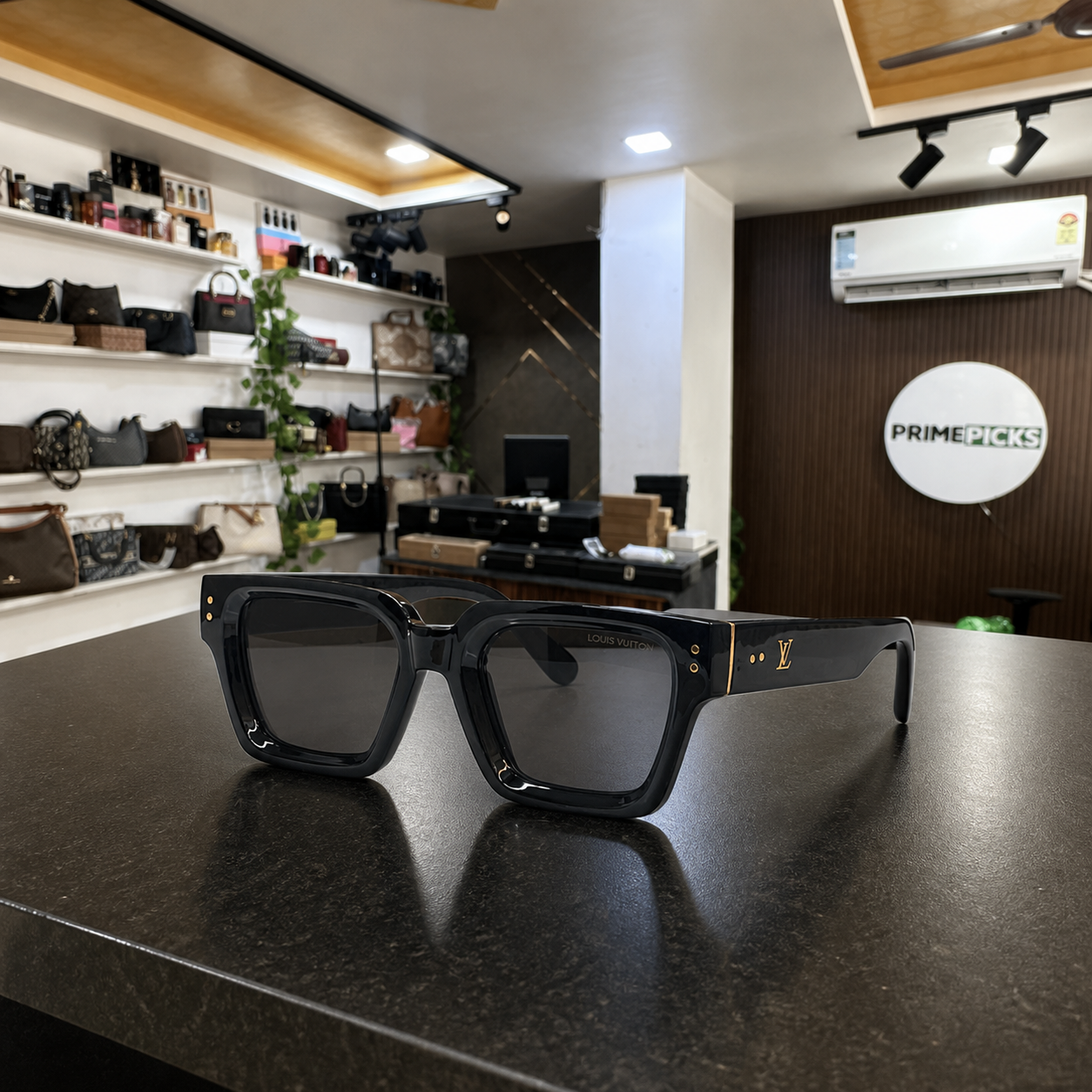 Louis Vuitton model 98170 square sunglasses in glossy black, PrimePicks office display
