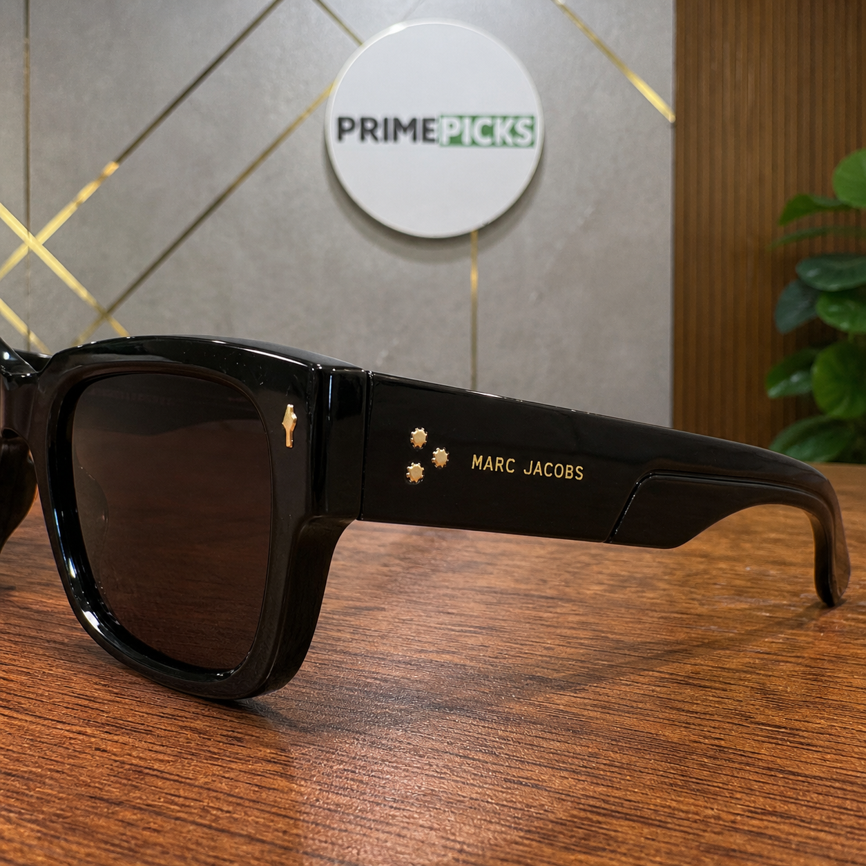 Marc Jacobs glossy black sunglasses gold-tone ornament and temple detail