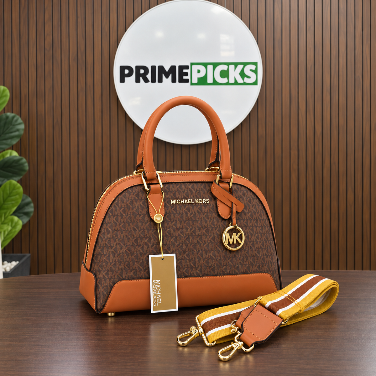 Michael Kors Alma monogram handbag in the PrimePicks office with the main circular logo board