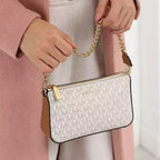 Michael Kors Jet Set Signature Shoulder Bag in Vanilla Signature worn on the shoulder