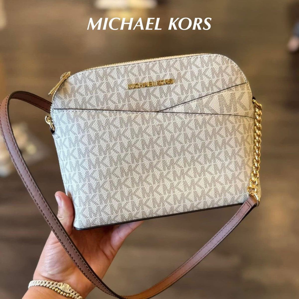 Michael Kors Jet Set Travel dome crossbody bag in Vanilla Signature handheld view