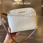 Michael Kors Jet Set Travel dome crossbody bag in Vanilla Signature handheld view