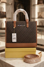 Michael Kors Mini Tote in Brown Signature with included box and shoulder strap