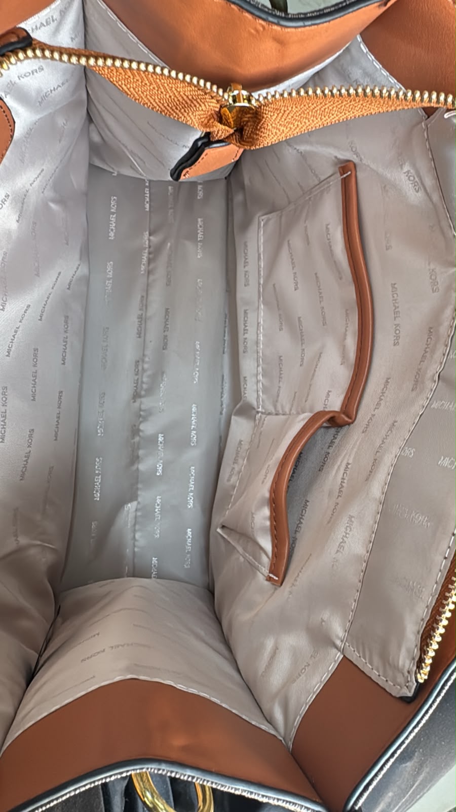 Michael Kors Mini Tote branded interior and storage pockets