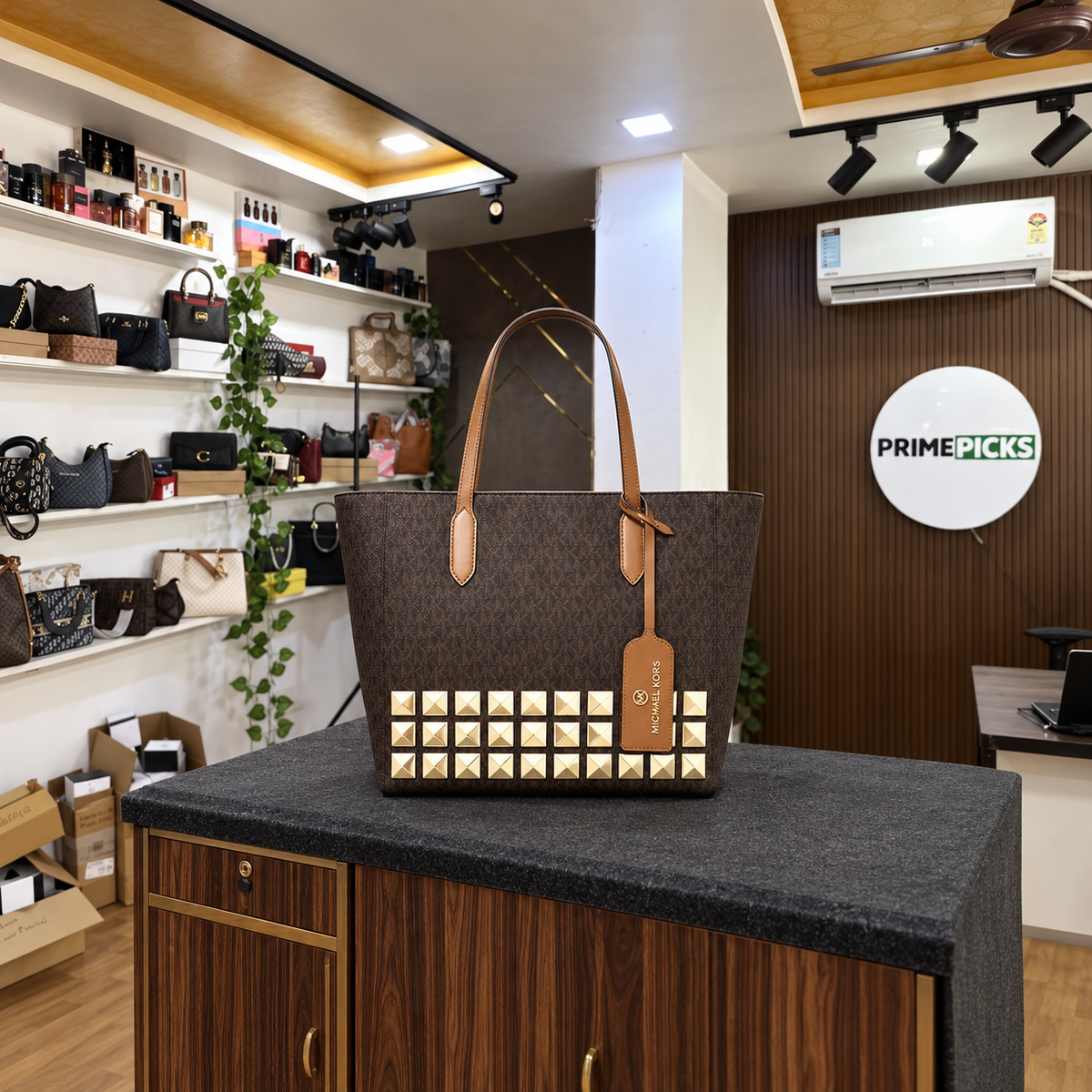 Michael Kors Sinclair brown studded tote in the PrimePicks showroom