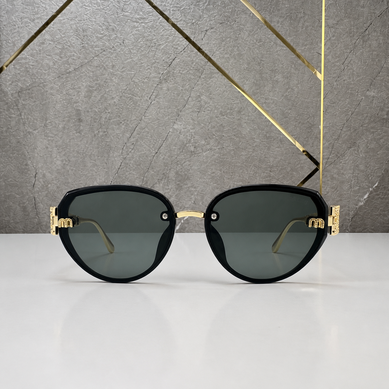 Miu Miu jeweled hinge sunglasses in glossy black, front view