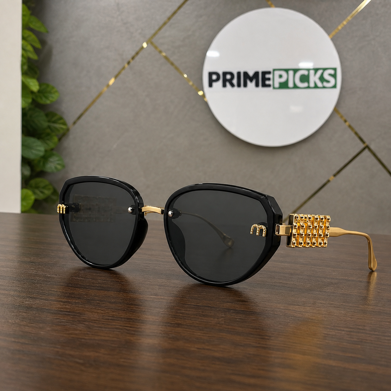 Miu Miu black and gold-tone butterfly sunglasses hero view in the PrimePicks office
