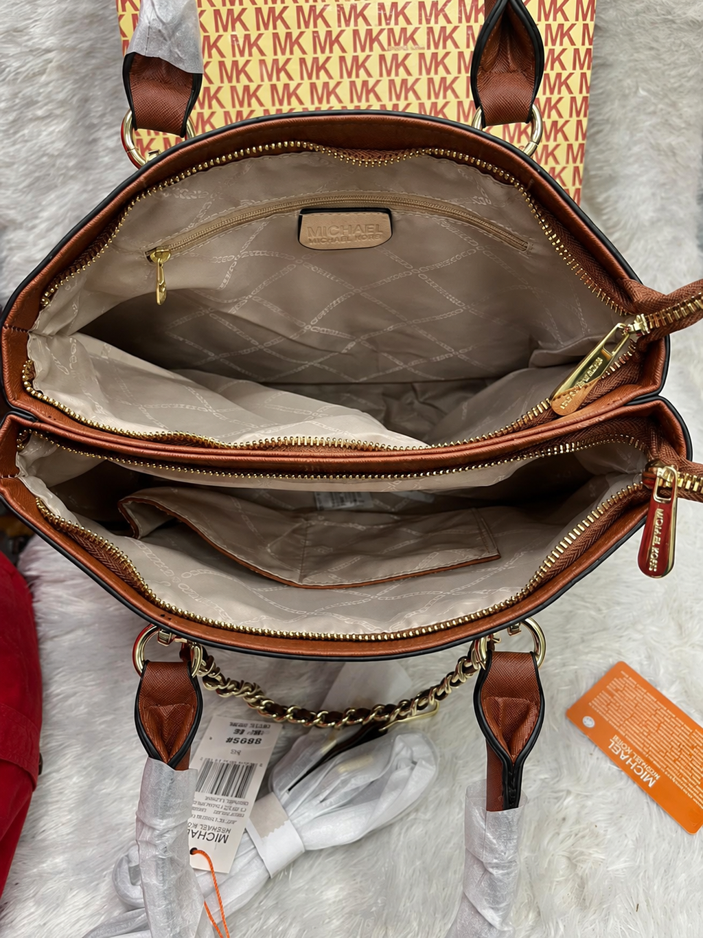 Michael Kors Cece Mono handbag interior compartments and zip pockets