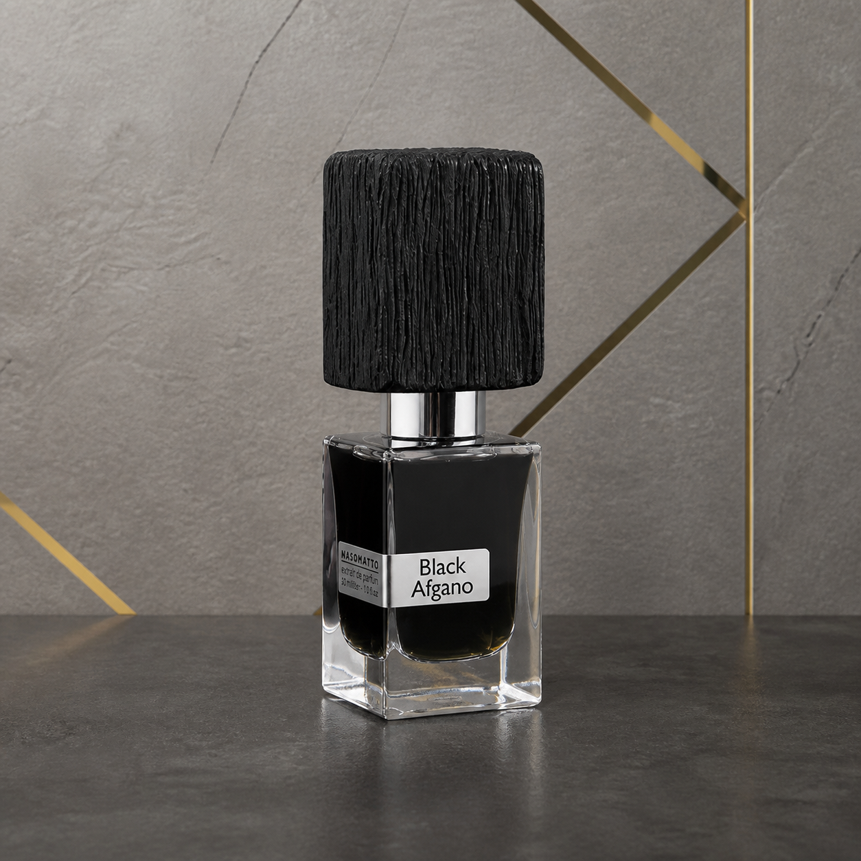 Nasomatto Black Afgano Extrait de Parfum 30ml bottle against the PrimePicks stone wall