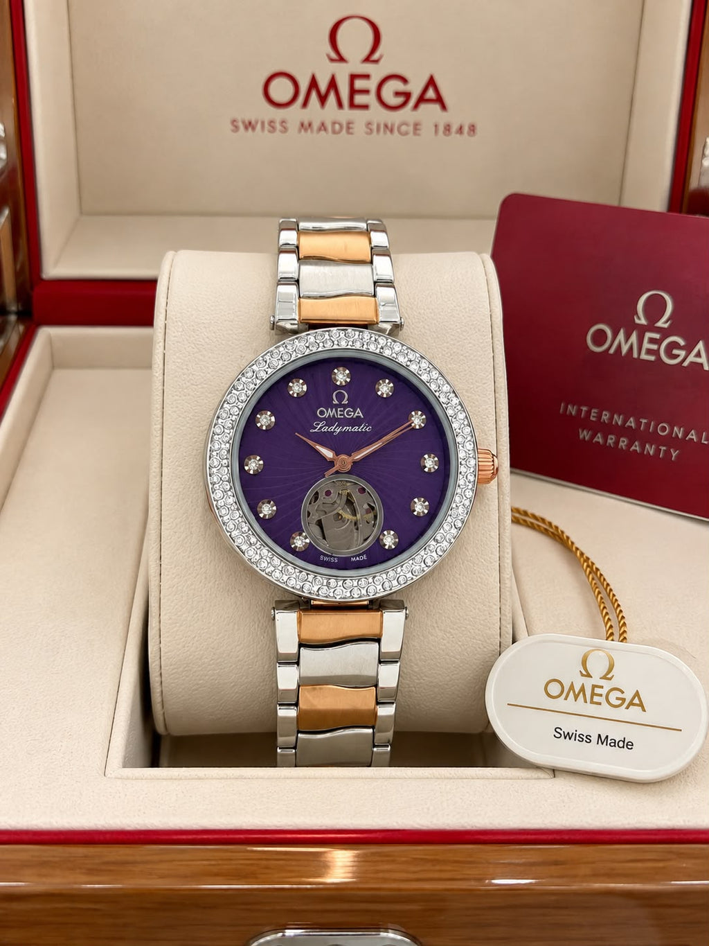 Omega Ladymatic purple dial watch with brand-name presentation box