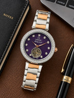 Omega Ladymatic purple dial open-heart watch arranged on a desk