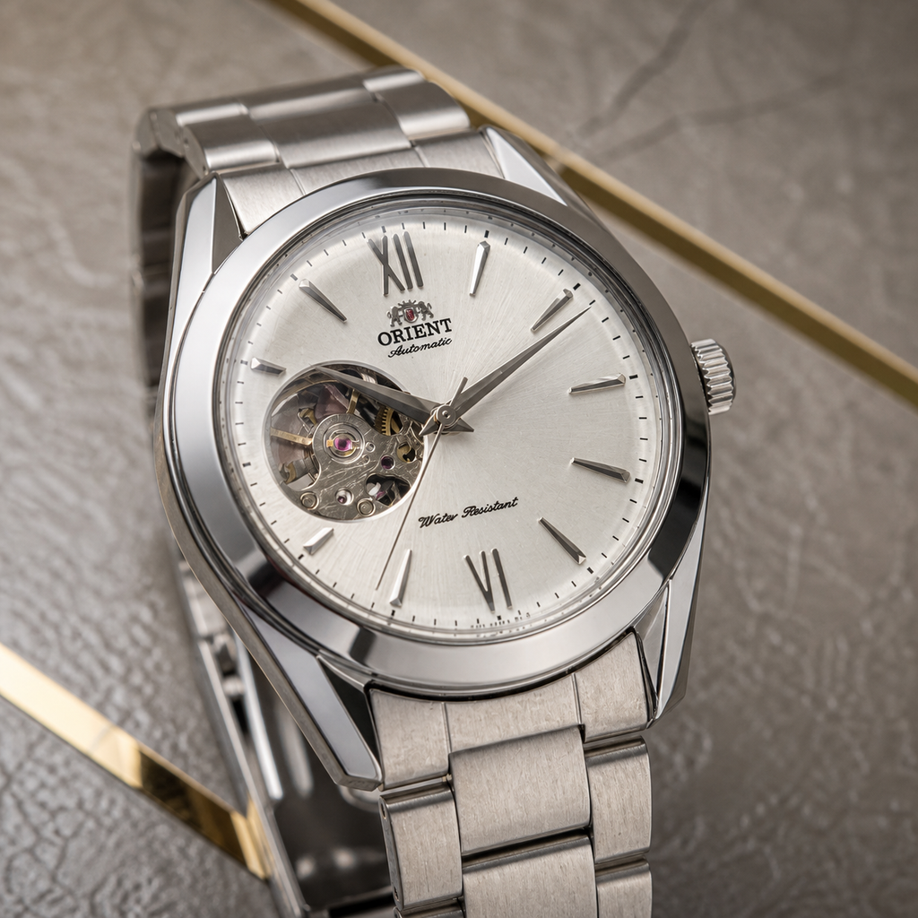 Close-up of Orient automatic watch ivory open-heart dial and silver-tone case in the Primepicks office