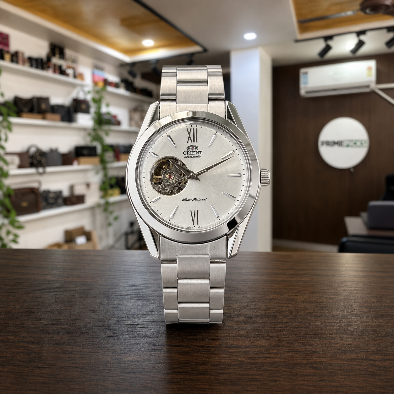 Orient open-heart automatic men’s watch displayed upright in the full Primepicks office interior