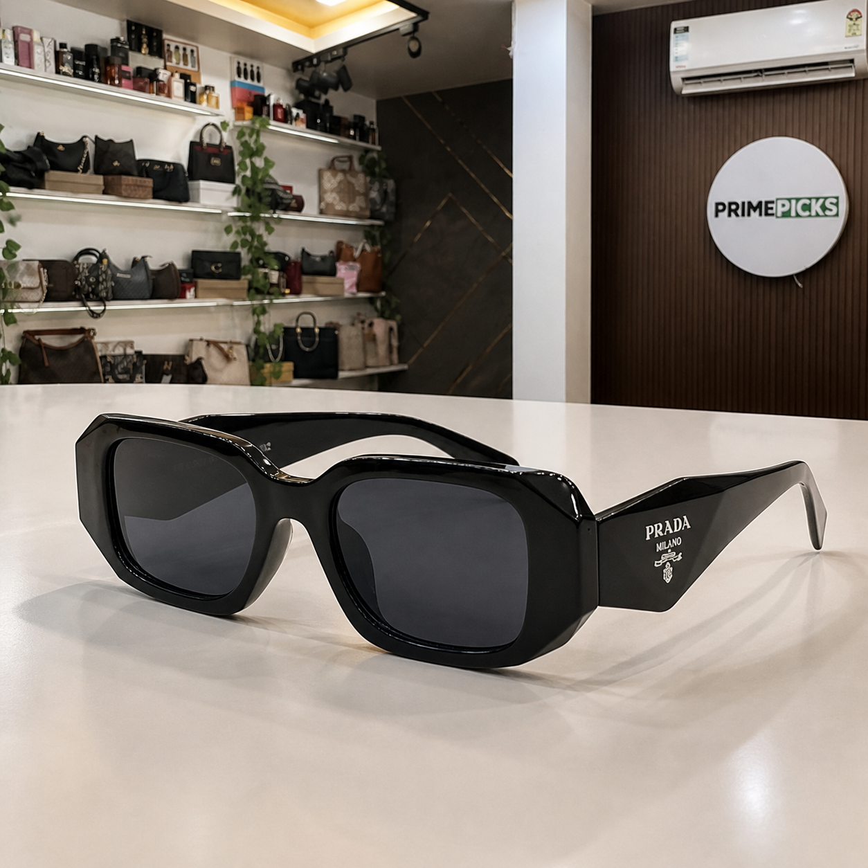 Prada Milano angular rectangular sunglasses in glossy black, alternate angle