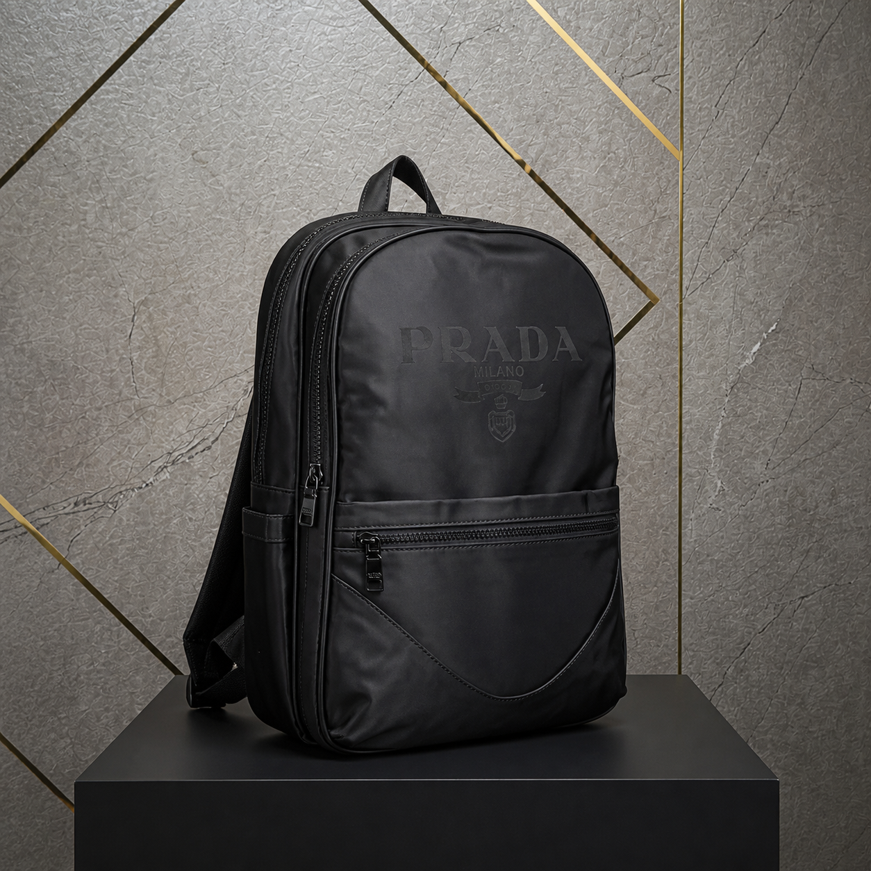 Prada Re-Nylon black backpack front view in grey and gold office
