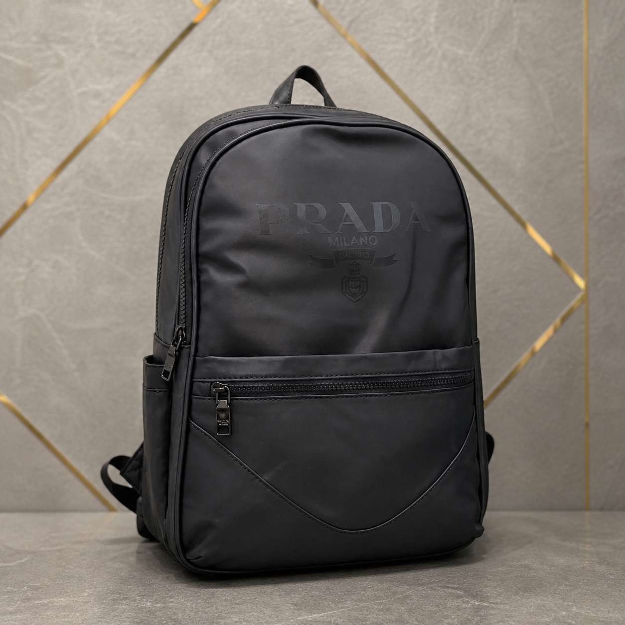 Prada Re-Nylon backpack tonal branding, zipper and front pocket details