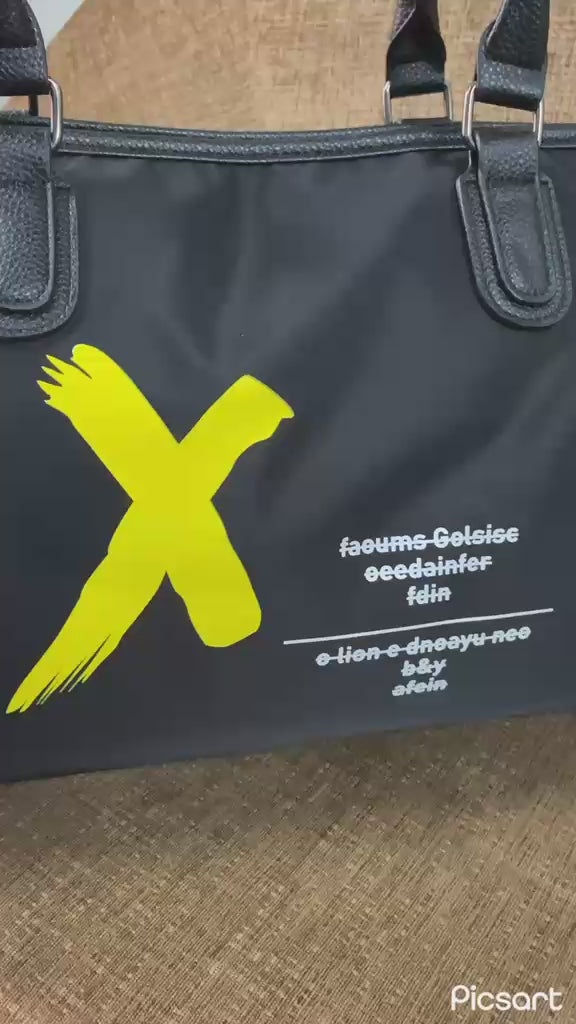 Supplier video of the black duffel bag with yellow graphic