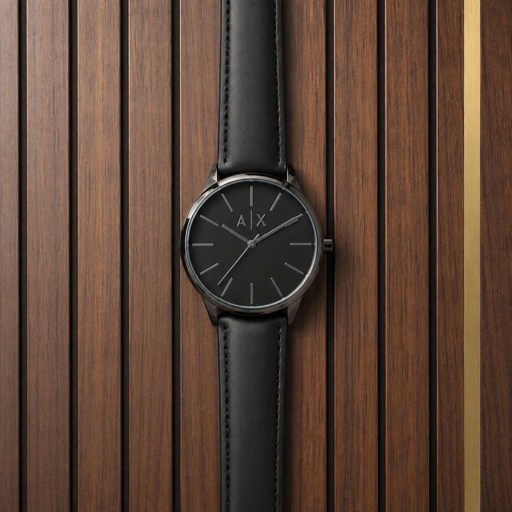 PrimePicks black minimalist A|X dial watch flat lay