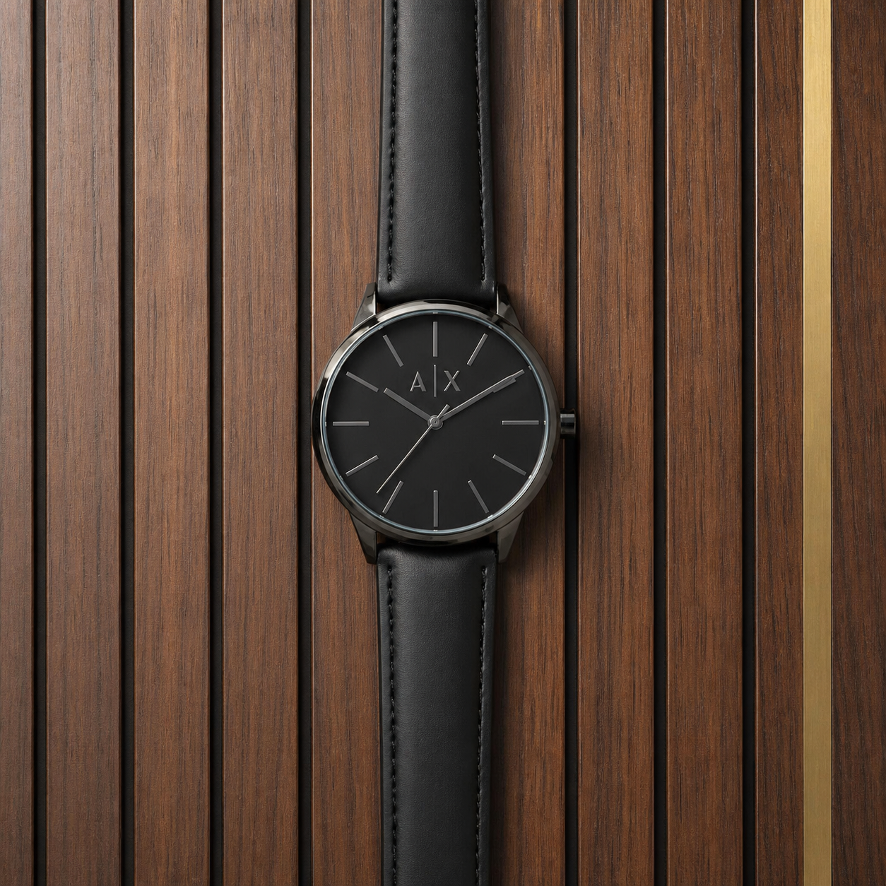 PrimePicks black minimalist A|X dial watch flat lay