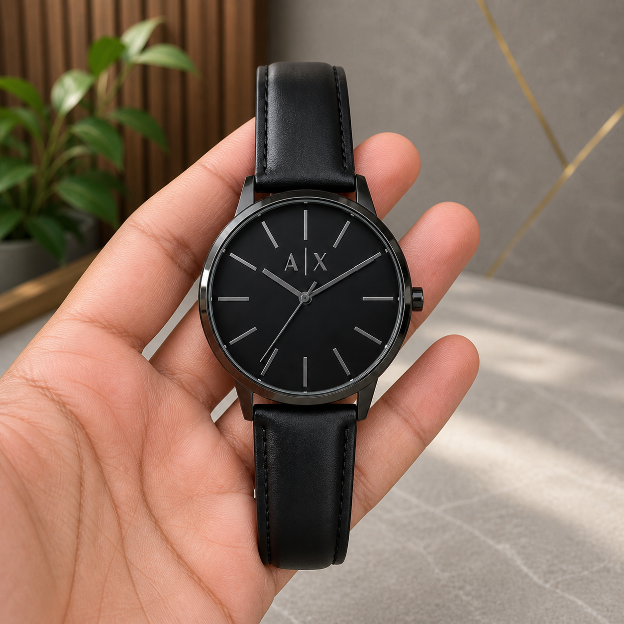 PrimePicks black minimalist A|X dial watch hand held scale view