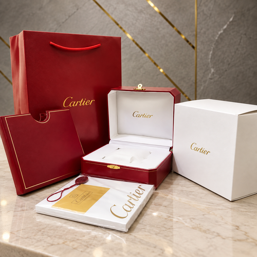 Digitally staged optional Cartier OG packaging kit in a PRIMEPICKS office setting; watch not included