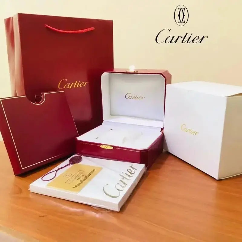 Optional Cartier OG packaging kit with red presentation box, carry bag, document folder, white outer carton and supplied booklet packet; watch not included