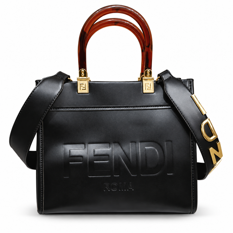 Fendi-marked black tote with amber-brown handles; edited white-background image