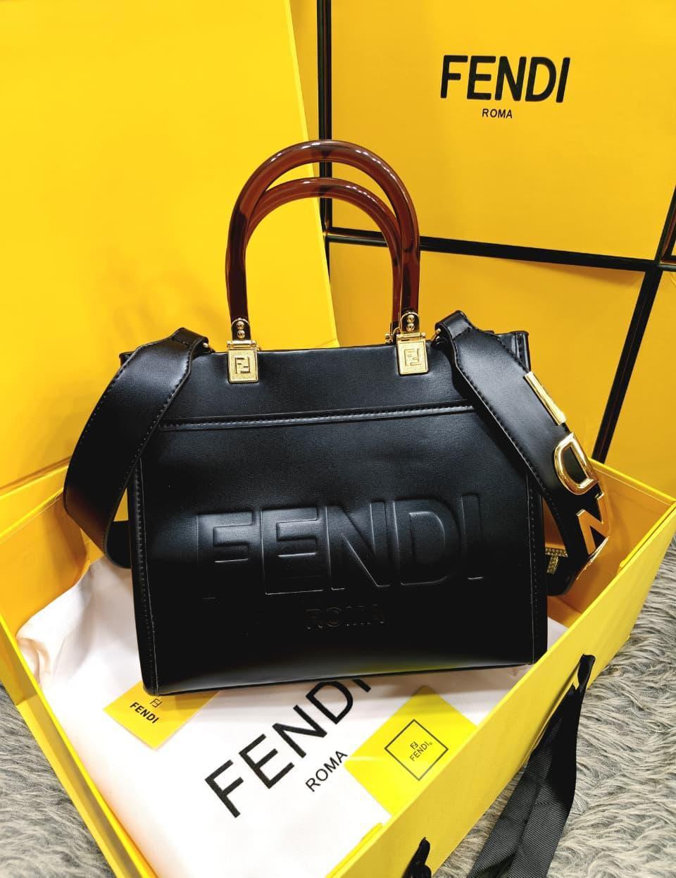 Original supplier reference photo of the black tote; included accessories are listed in the description