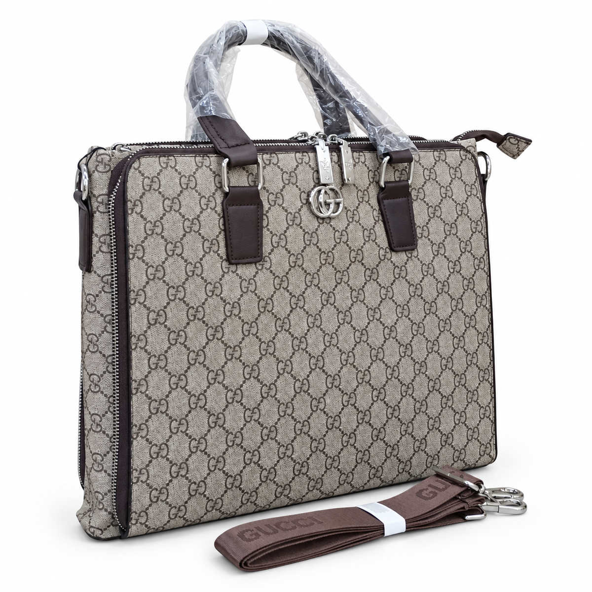 Gucci-marked taupe-grey monogram office bag with brown handles and detachable strap; edited white-background image
