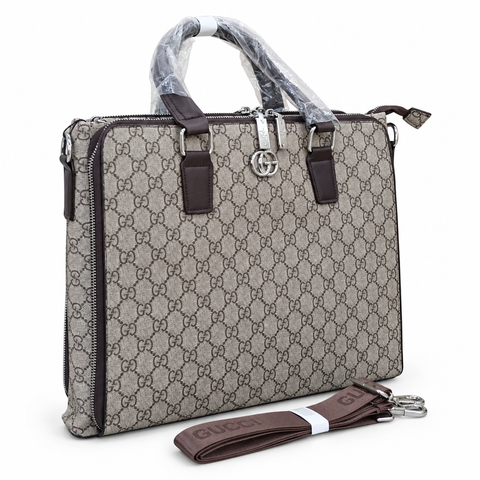 Gucci-marked taupe-grey monogram office bag with brown handles and detachable strap; edited white-background image