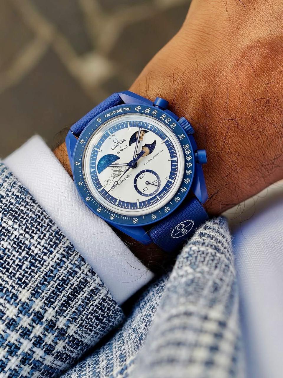 Navy MoonSwatch Mission to Earthphase replica watch worn on the wrist