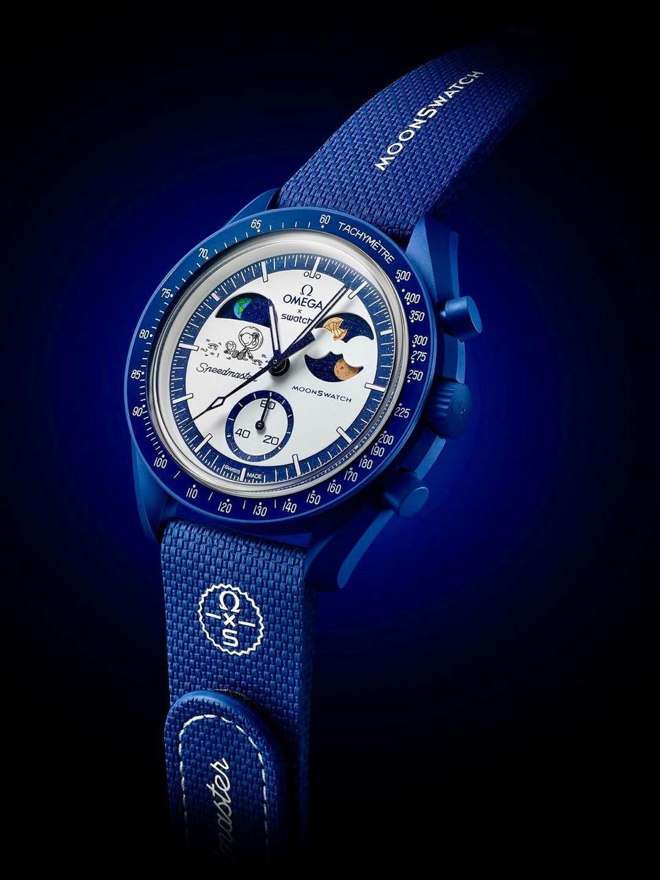 Dark studio front view of the navy MoonSwatch Mission to Earthphase replica watch