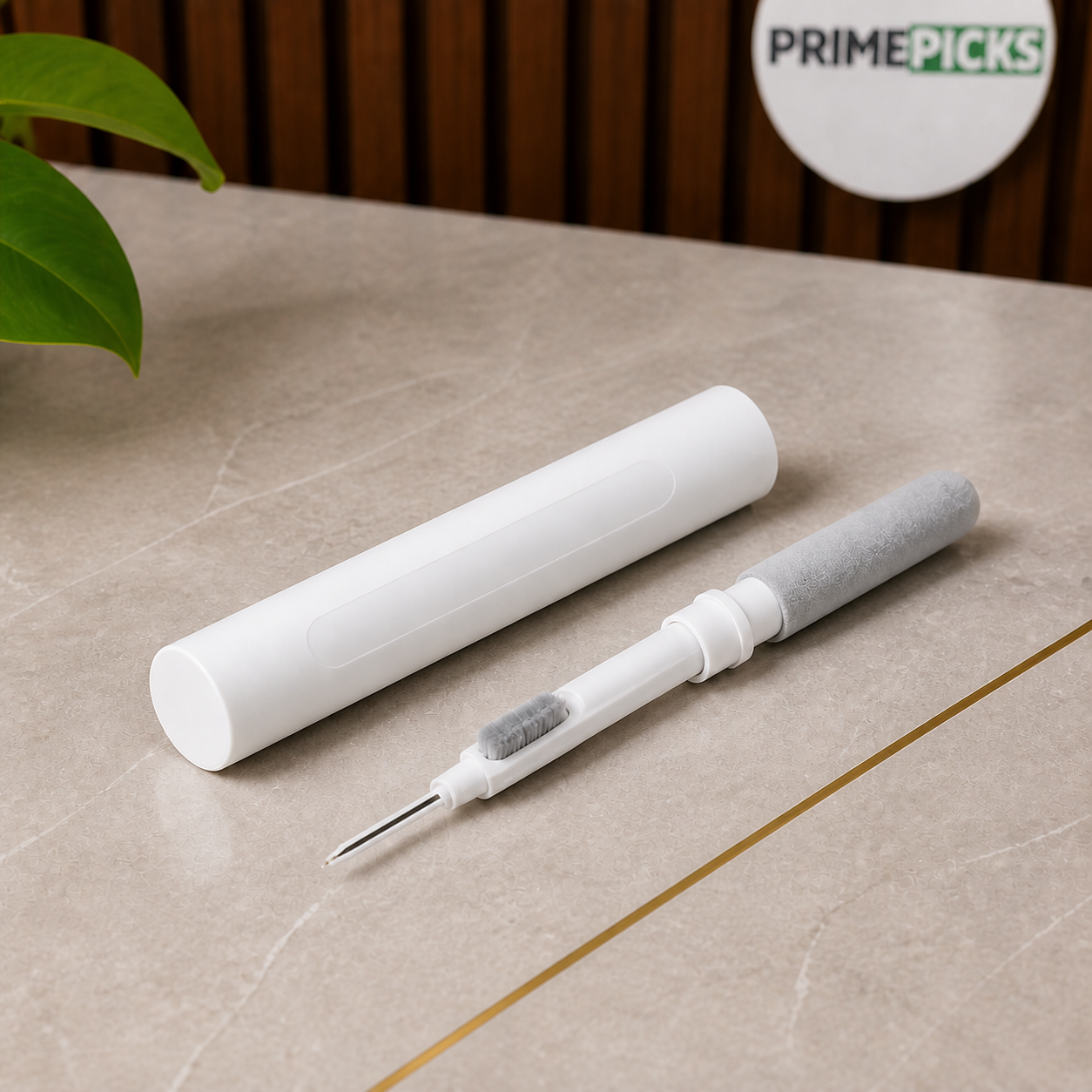 White PrimePicks Multi-Clean Pen laid open on grey stone surface