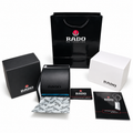 Optional Rado OG kit with curved presentation case, carry bag and paperwork on white; watch not included