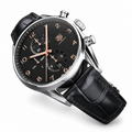 TAG Heuer Carrera Calibre 1887-style replica watch with black dial and black leather strap on a clean white background; edited supplier-reference image