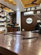 TAG Heuer rimless rectangular brown temple optical frame in the actual PrimePicks office
